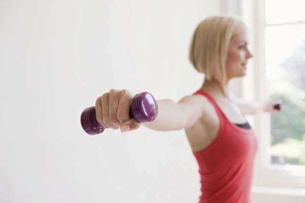 Build Muscle Strength and a Better Body With Dumbbell Workout Photo by: woman.thenest.com