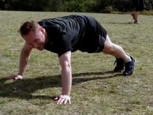 A participant of Boot Camp King George Park performs a set of push ups.
